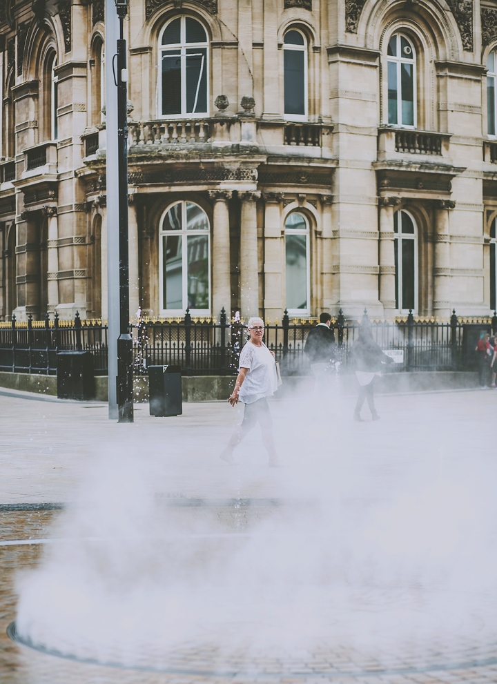 Hull Queen Victoria Square Fountains Steam Women walking past