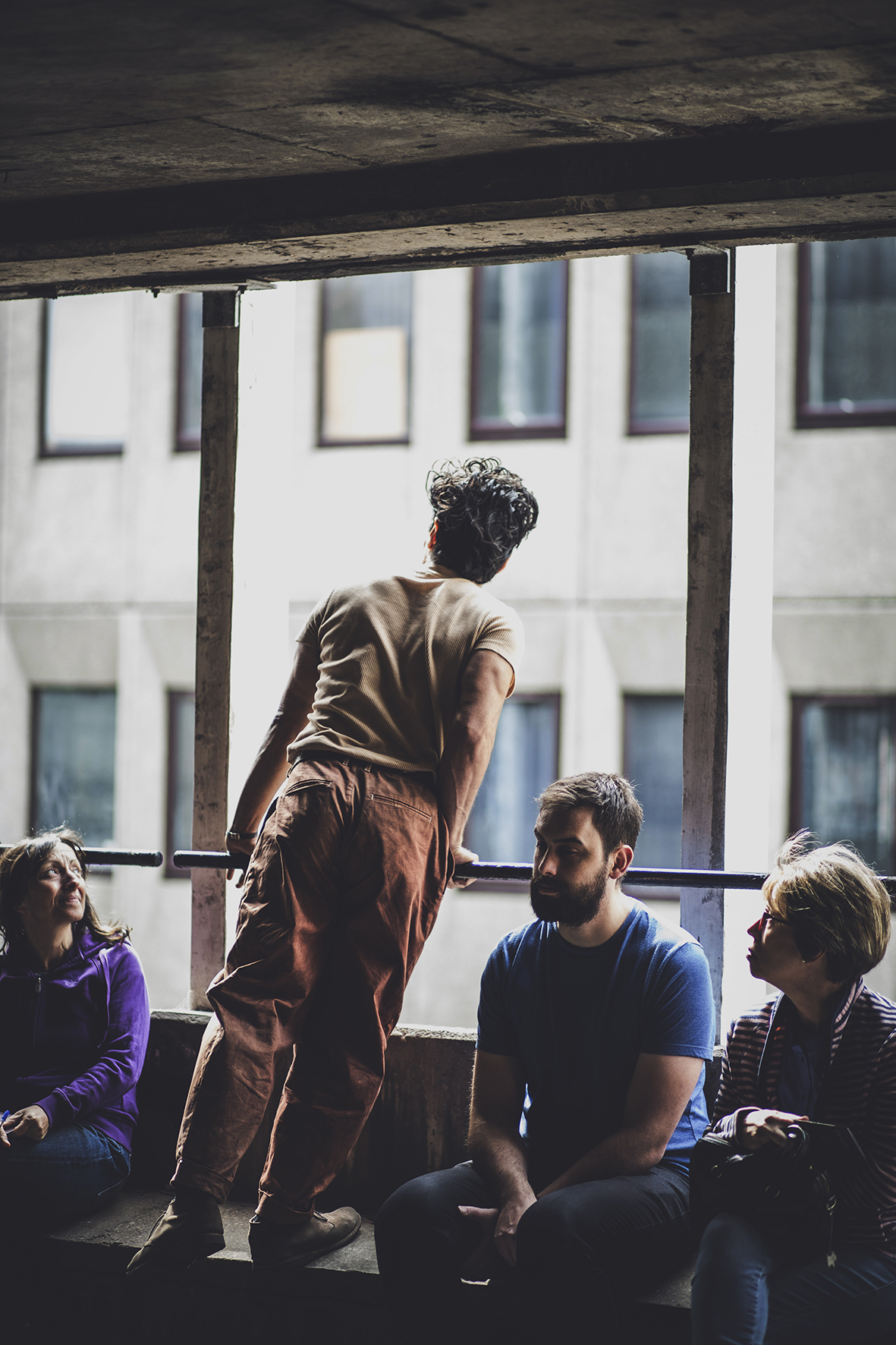 MAN LOOKING THROUGH THE WINDOW