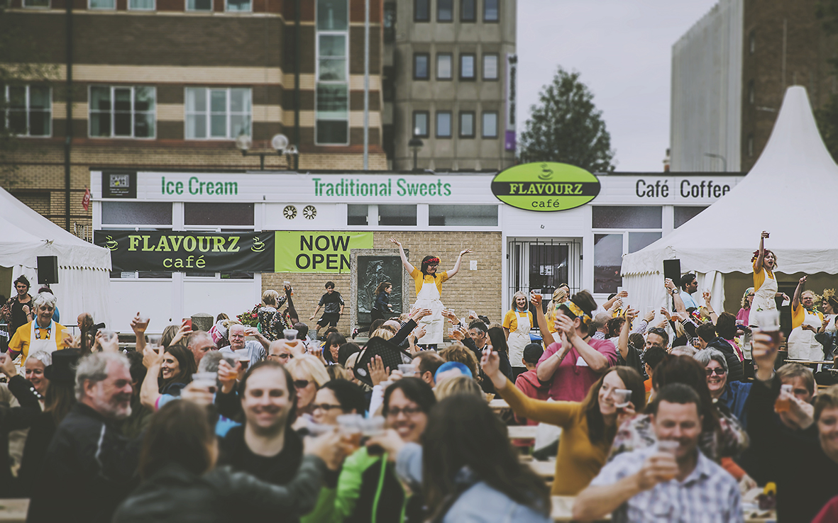 PEOPLE RAISING GLASS AT THE